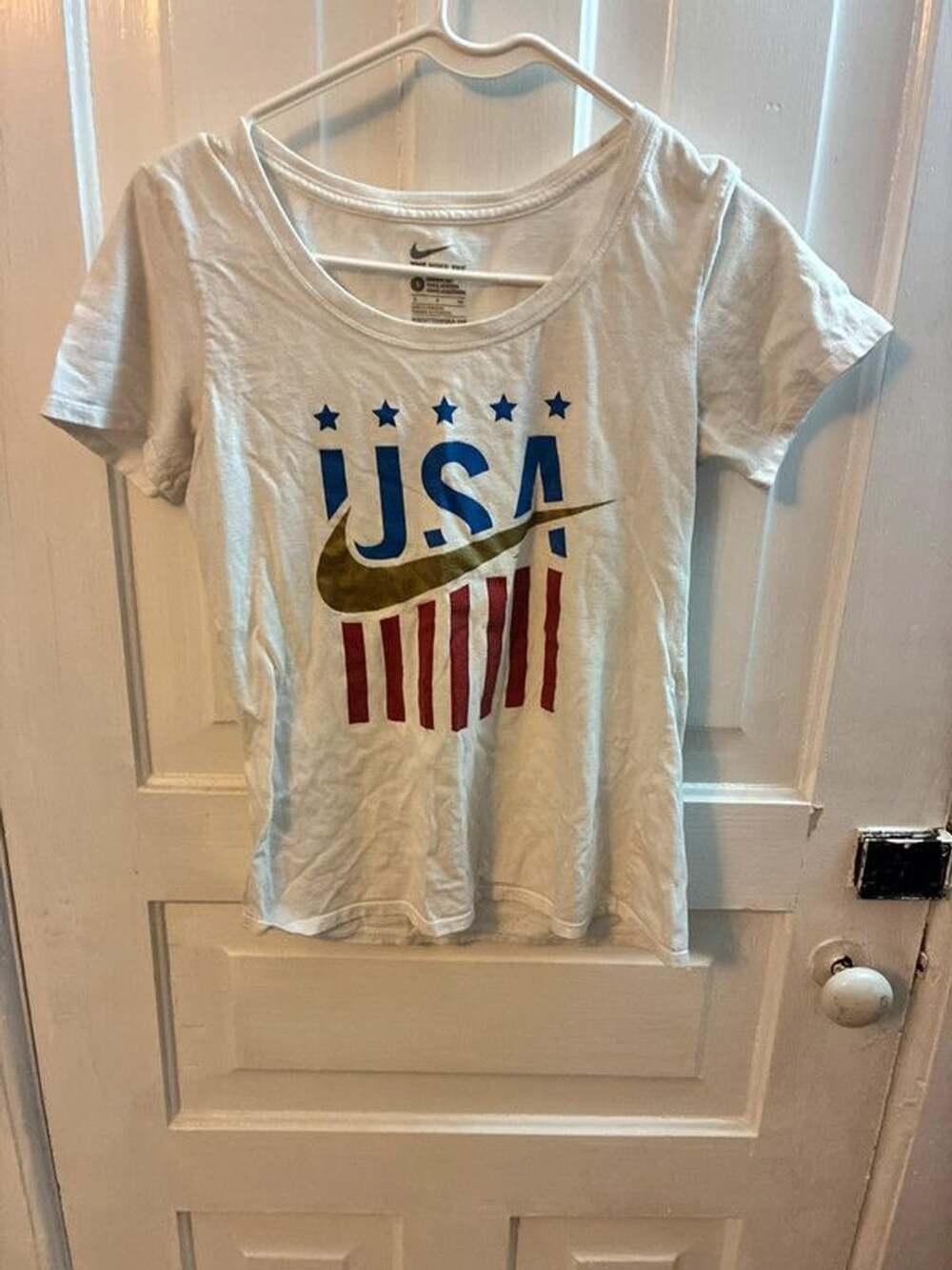 White Nike USA tee with gold Nike swoosh and red/white stripes, size S